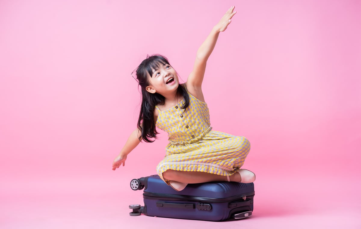 Image of Asian Child with Suitcase, Summer Concept